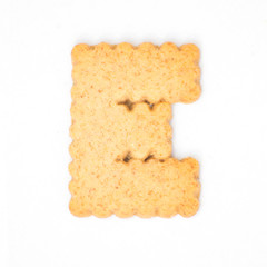 letter E made of cracker cookie isolated on white background.