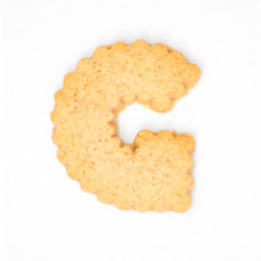letterG made of cracker cookie isolated on white background.