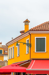 Beautiful window decorated with flowers in Italy