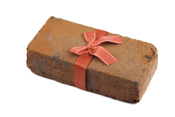 brick in a gift with bow and ribbon isolated