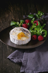 Goat cheese with honey and raspberries