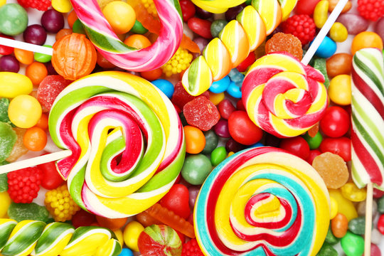 Different fruit candies background