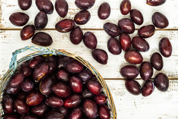 Fresh plums on wood background.