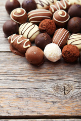 Chocolates on grey wooden background