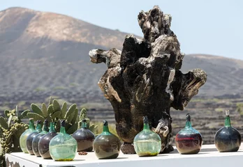 Fototapeten A big bottles with grape wine - malvasia.  Lanzarote, Spain © wjarek
