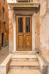 Fototapeta na wymiar Entrance of an apartment building in Burano, Venice, Italy.