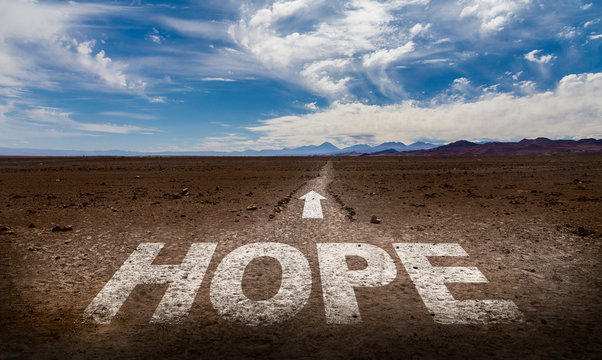 Hope written on desert road