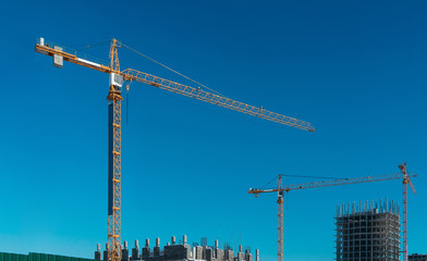 Construction workplace with a cranes