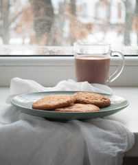 Cookies and coffee near the window