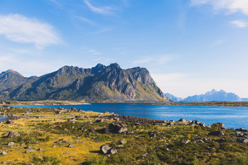 Classic norwegian scandinavian summer landscape with mountains, fjord, lake and a church, with a...