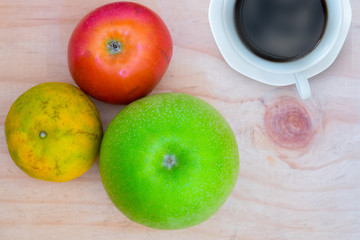 Thai fruits and coffee on wooden table