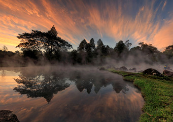 Hot spring at national park during sunrise, Thailand