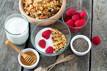 healthy snack - granola on wooden surface