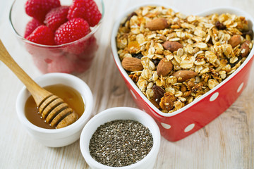 healthy snack - granola on wooden surface