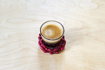 Cup of strong frothy black coffee