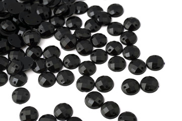 Black rhinestone on white background