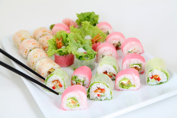 sushi set on white plate. Traditional japanese sushi rolls