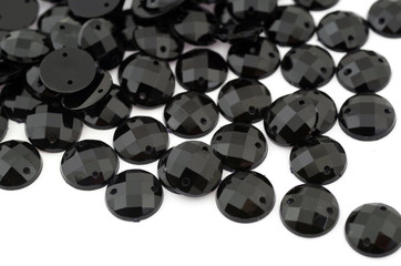 Black rhinestone on white background