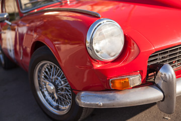 Obraz na płótnie Canvas Close up detail of a red vintage car