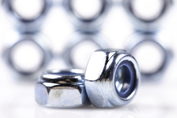 metal nuts closeup background