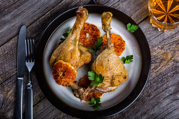Roasted duck legs cooked in mandarins