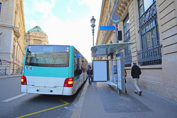 Paris, France, February 6, 2016: Bus  stop on the street of Paris, France - obrazy, fototapety, plakaty