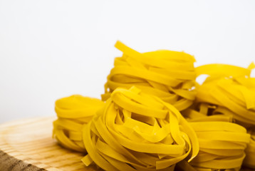 Italian noodle nest on wooden