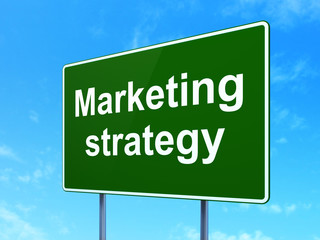 Advertising concept: Marketing Strategy on road sign background