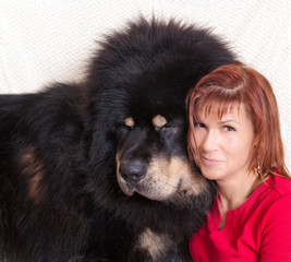 Black Tibetan Mastiff and a young woman