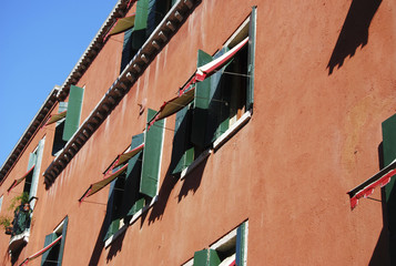 Green windows on Venice building