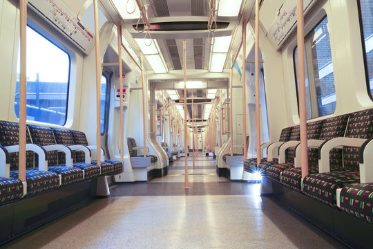 Interior of London Underground Circle Line carriage compartment, stopped at Barbican tube station