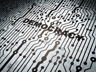 Fototapeta premium Political concept: circuit board with Democracy