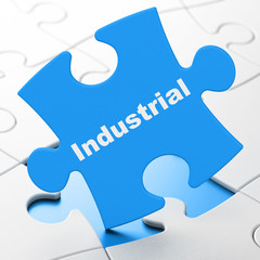 Industry concept: Industrial on puzzle background