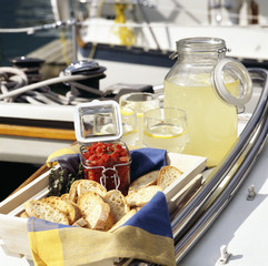 Bruschetta and lemonade on sailboat.