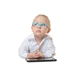 Kid in glasses sitting on the floor on a white background