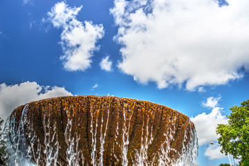 brown fountain under a blue sky