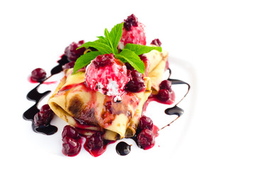 Pancakes with ice cream and cherry toping