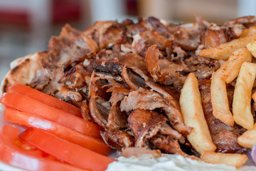 Greek gyros, meat, fried potatoes, tomatoes and onions, Athens Greece, national food, traditional Greek cuisine