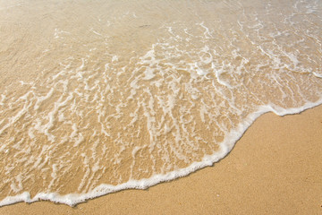 Wave of the sea on the sand beach , for background