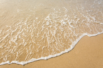 Fototapeta na wymiar Wave of the sea on the sand beach , for background