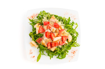 Salad with chicken meat, tomato and rucola