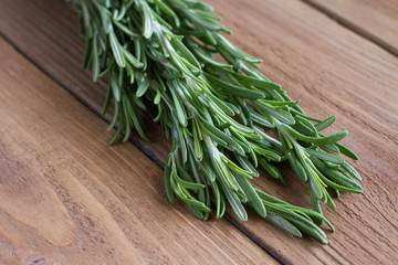 Rosemary on a wooden background