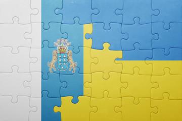 puzzle with the national flag of ukraine and canary islands