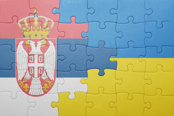 puzzle with the national flag of ukraine and serbia