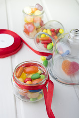 Multicolor candies in glass jars
