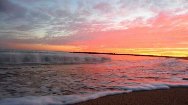 Cinemagraph motion photo, sea waves at sunset