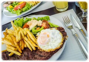 Beef steak with egg and chips