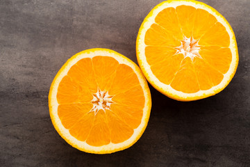 Orange slice on the grey  background.