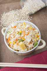 Rice with vegetables on white background