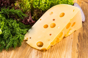 yellow cheese with fresh vegetables
